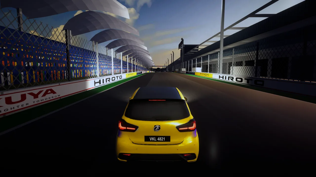 Into the last hairpin at Sepang, the grandstand's crowd under the white leaf roofs